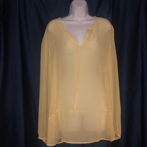 Sheer yellow New York and Company blouse.